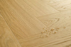 Wooden floor with water droplets on a light wood background