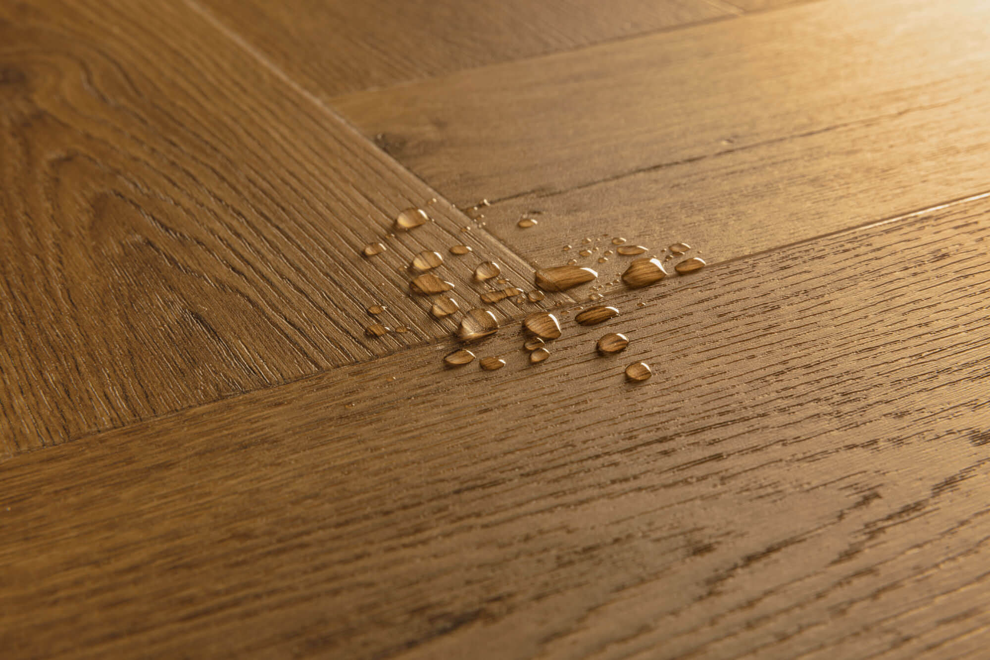 Wooden floor with water droplets on it
