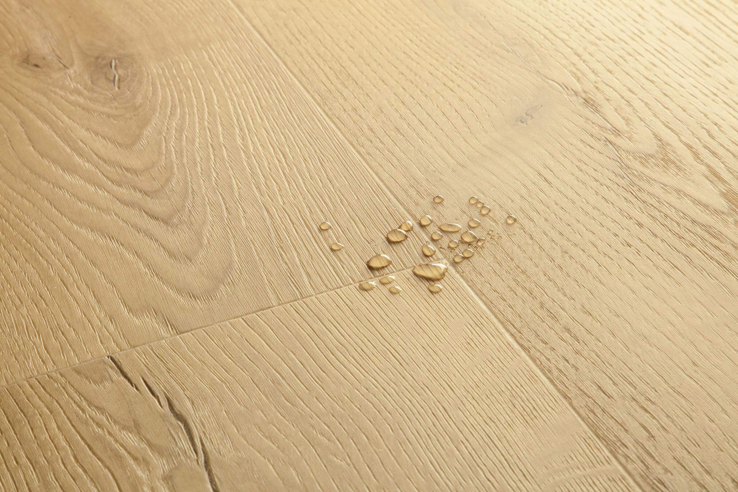 Close-up of a wooden floor with water droplets on it