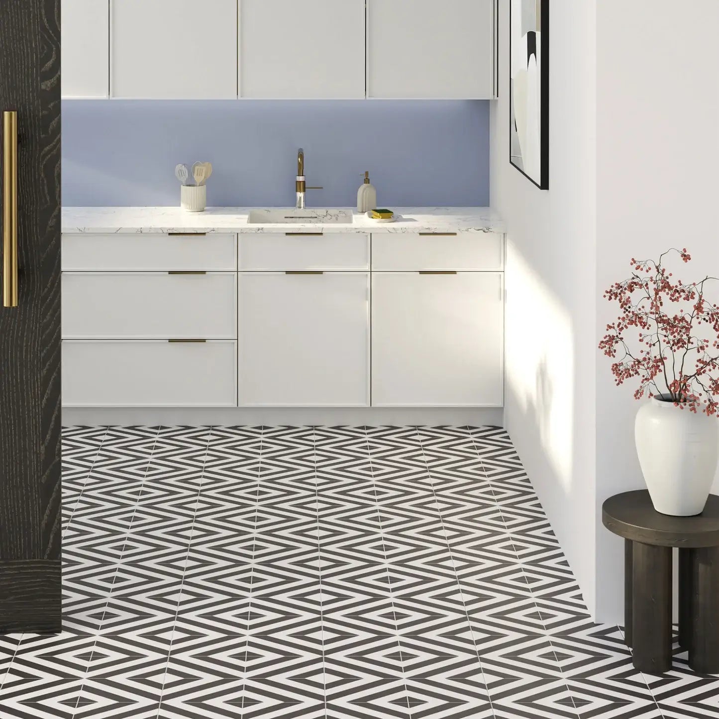 Modern kitchen with white cabinets, geometric black and white floor tiles, and decorative elements.