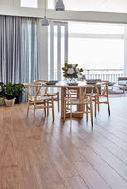 Dining area with wooden table and chairs in a modern home setting.