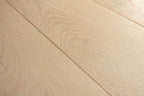 Close-up of light wood flooring with visible grain and texture