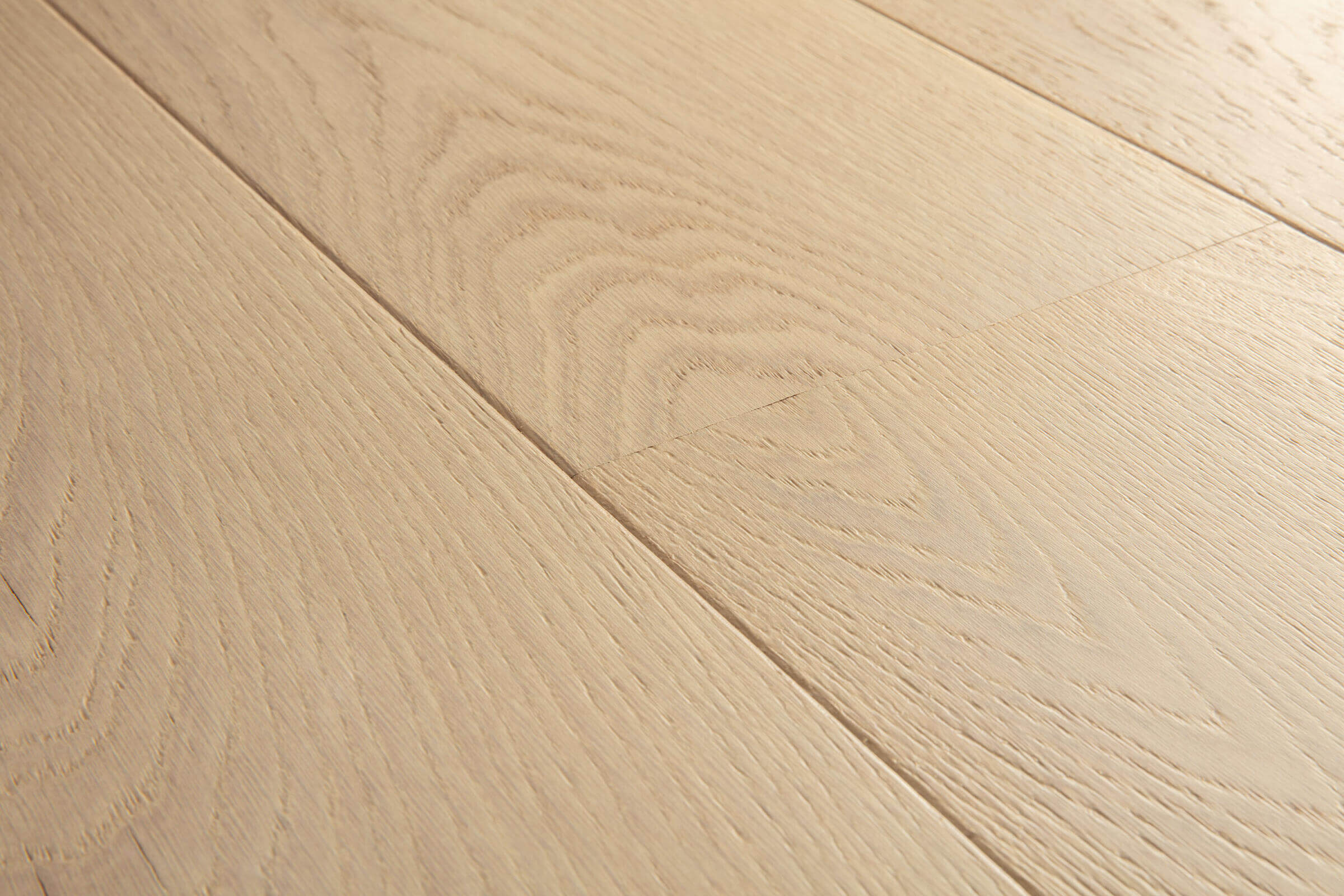 Close-up of light wood flooring with visible grain and texture