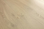 Close-up of a beige wooden surface with visible grain and texture