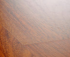 Close-up of a wooden surface with a gradient from brown to gray.