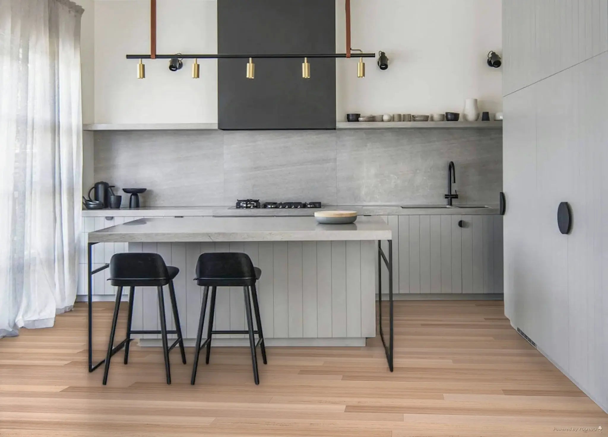 Modern kitchen with white cabinets, gray backsplash, and black bar stools.