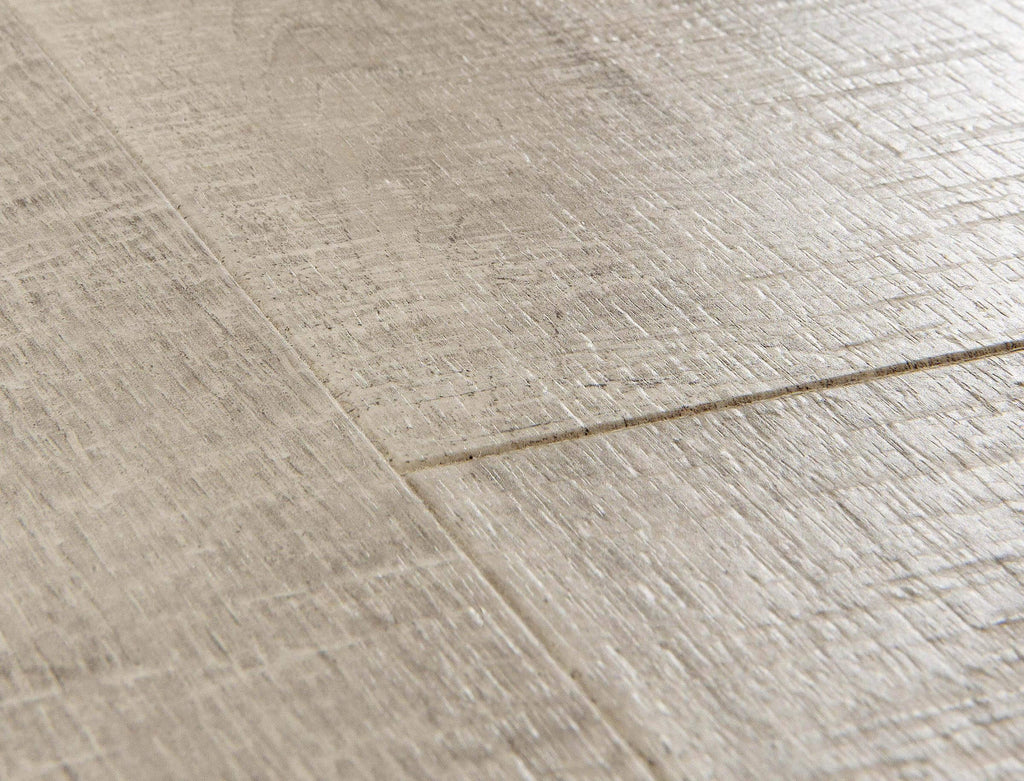 Close-up of a textured beige tile floor