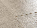 Close-up of a textured beige tile floor