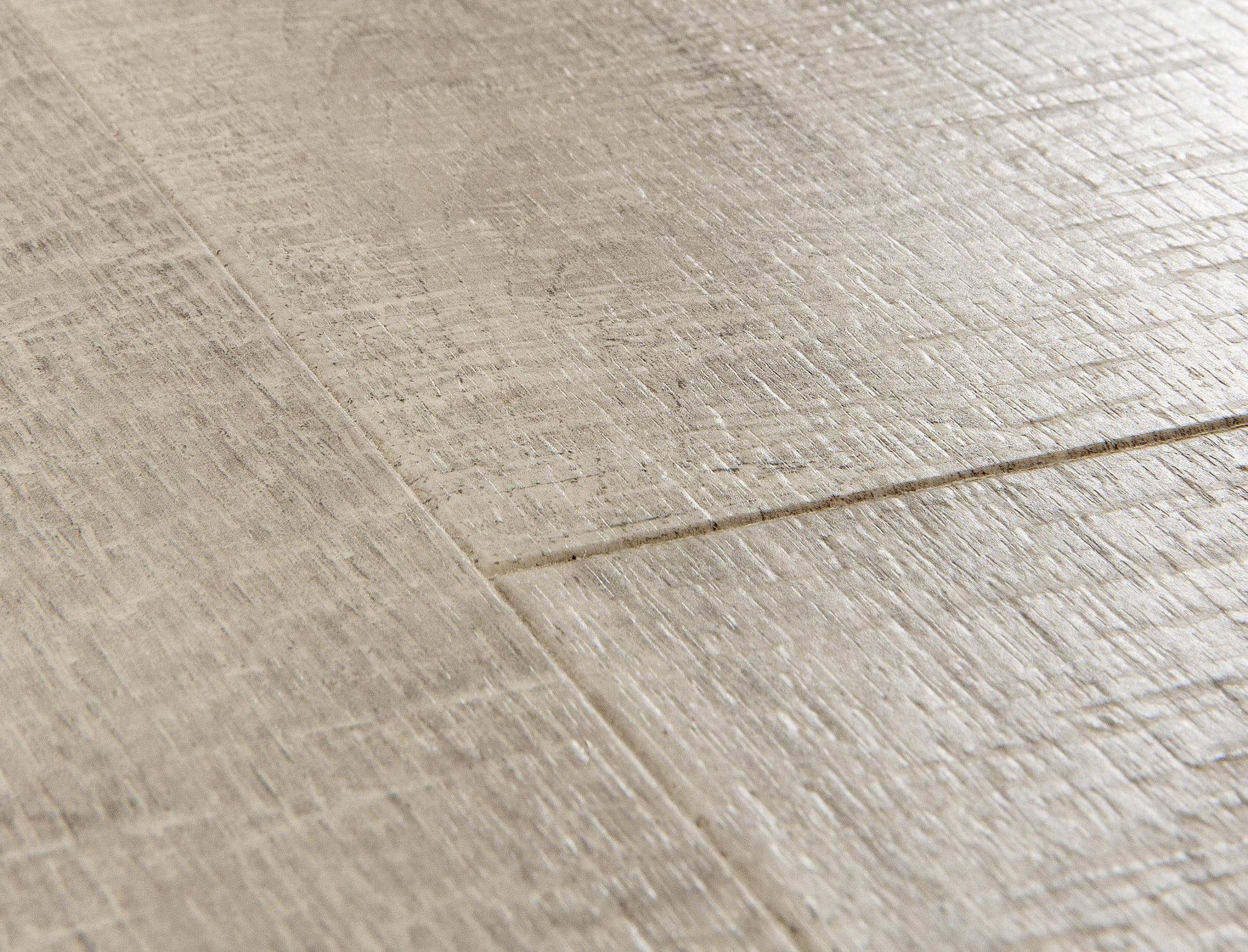 Close-up of a textured beige tile floor