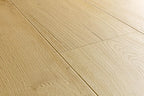 Light beige wood flooring planks with a natural oak-like grain texture.