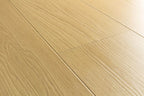 Light beige wood-look flooring planks with a natural oak grain texture.