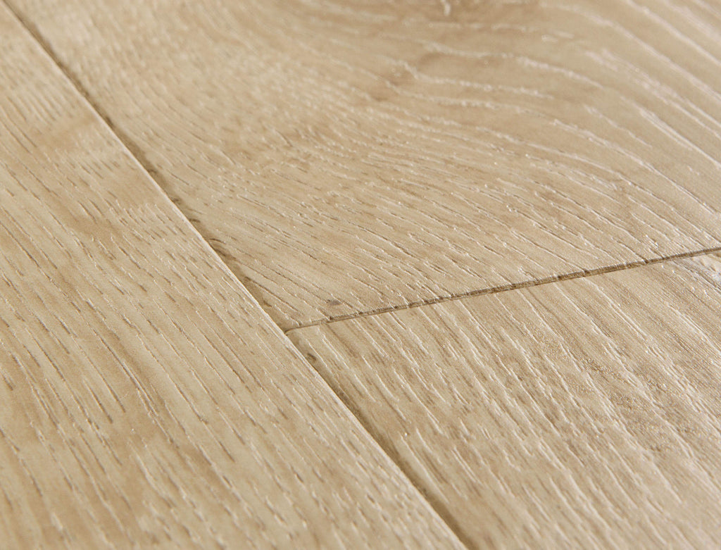 Close-up of a wooden floor with light brown planks.