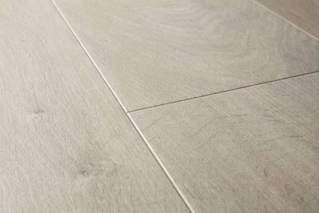 Close-up of light gray tiles with a wood-like texture