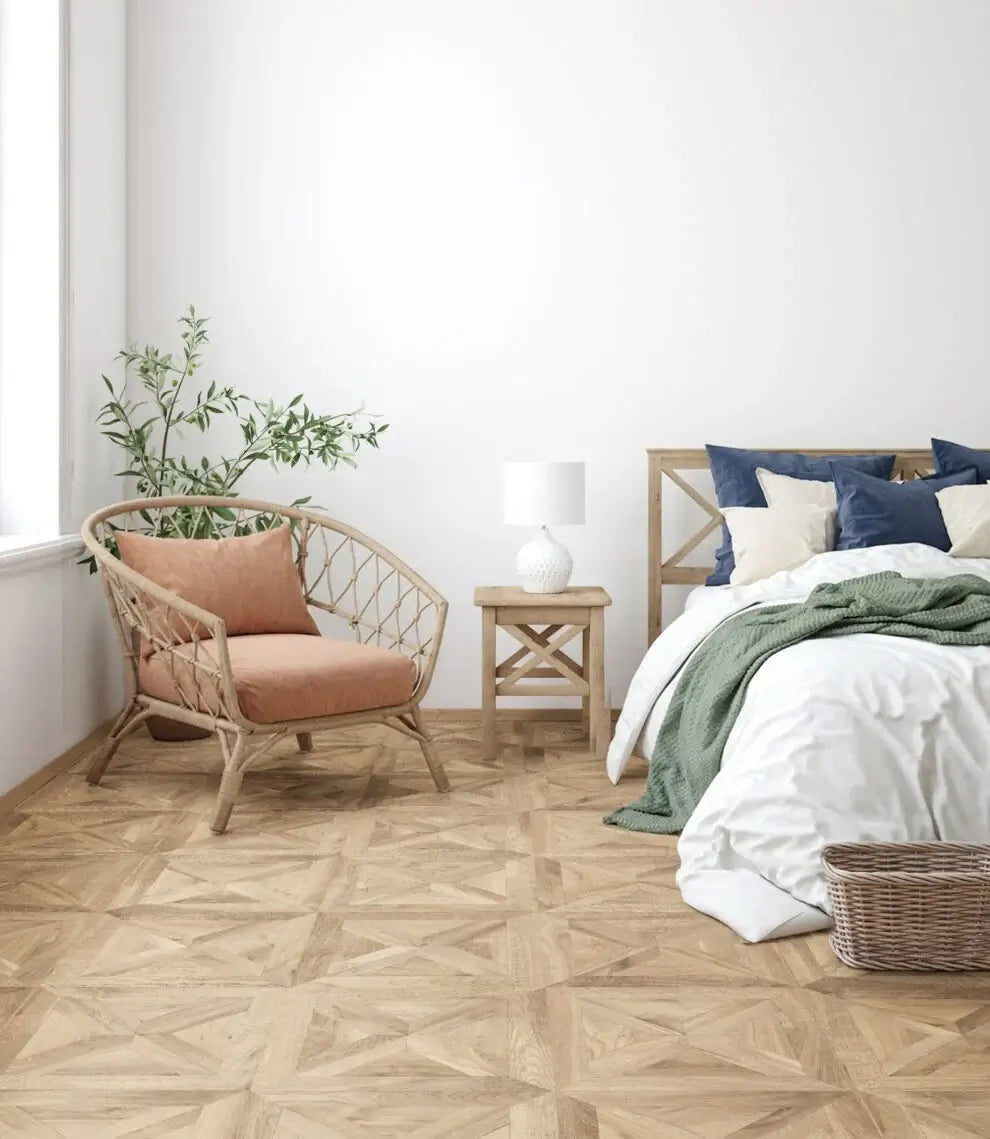 Modern bedroom with wooden floor, wicker chair, and bed with blue and green bedding.