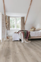 Bedroom with wooden flooring, bed, and window