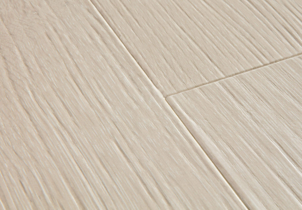 Close-up of a tiled floor with beige tiles