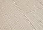Close-up of a tiled floor with beige tiles