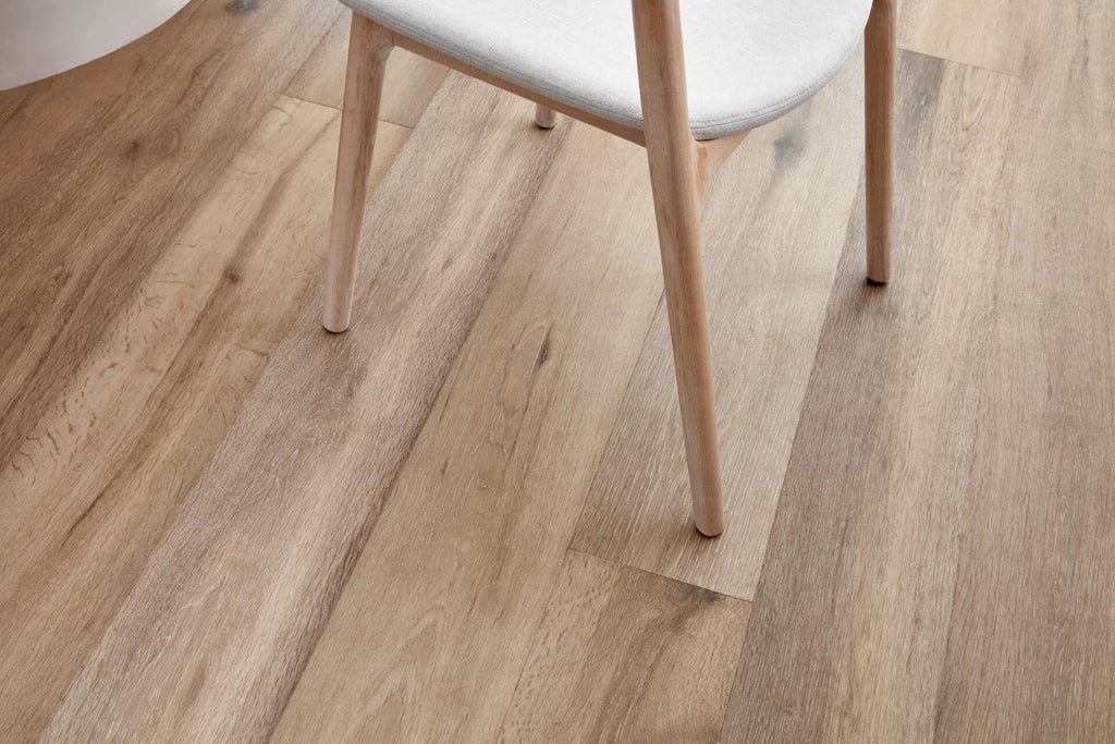 Wooden floor with a chair leg on a clear protective sheet