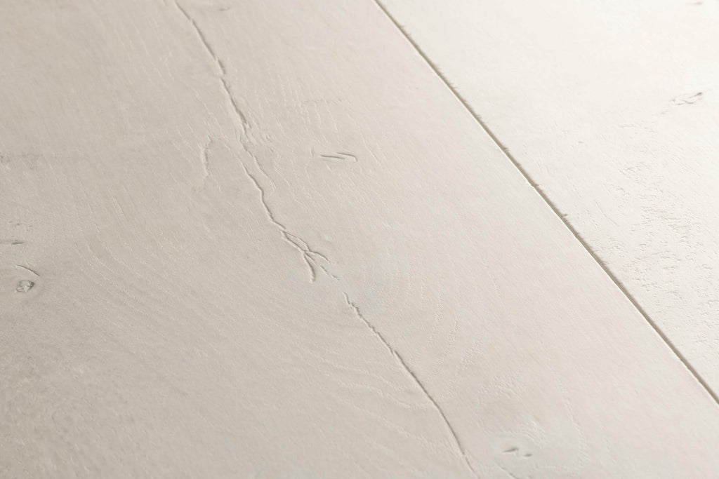 Close-up of a light gray ceramic tile with subtle texture