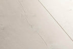 Close-up of a light gray ceramic tile with subtle texture
