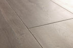 Close-up of gray wooden flooring with a focus on texture and pattern.