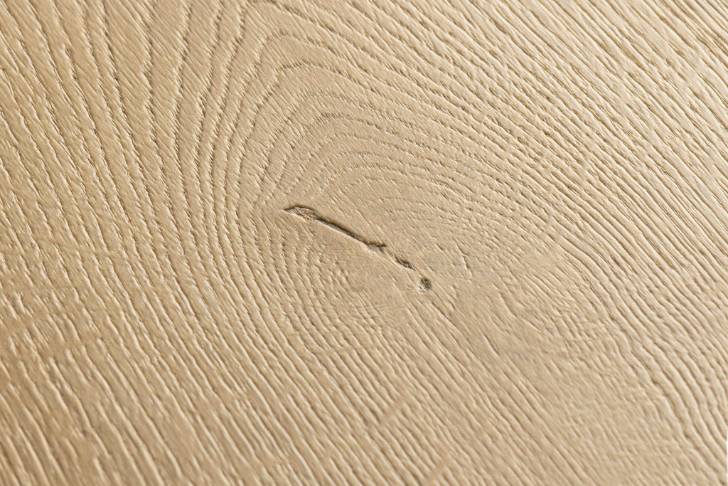 Close-up of a textured beige surface with subtle patterns