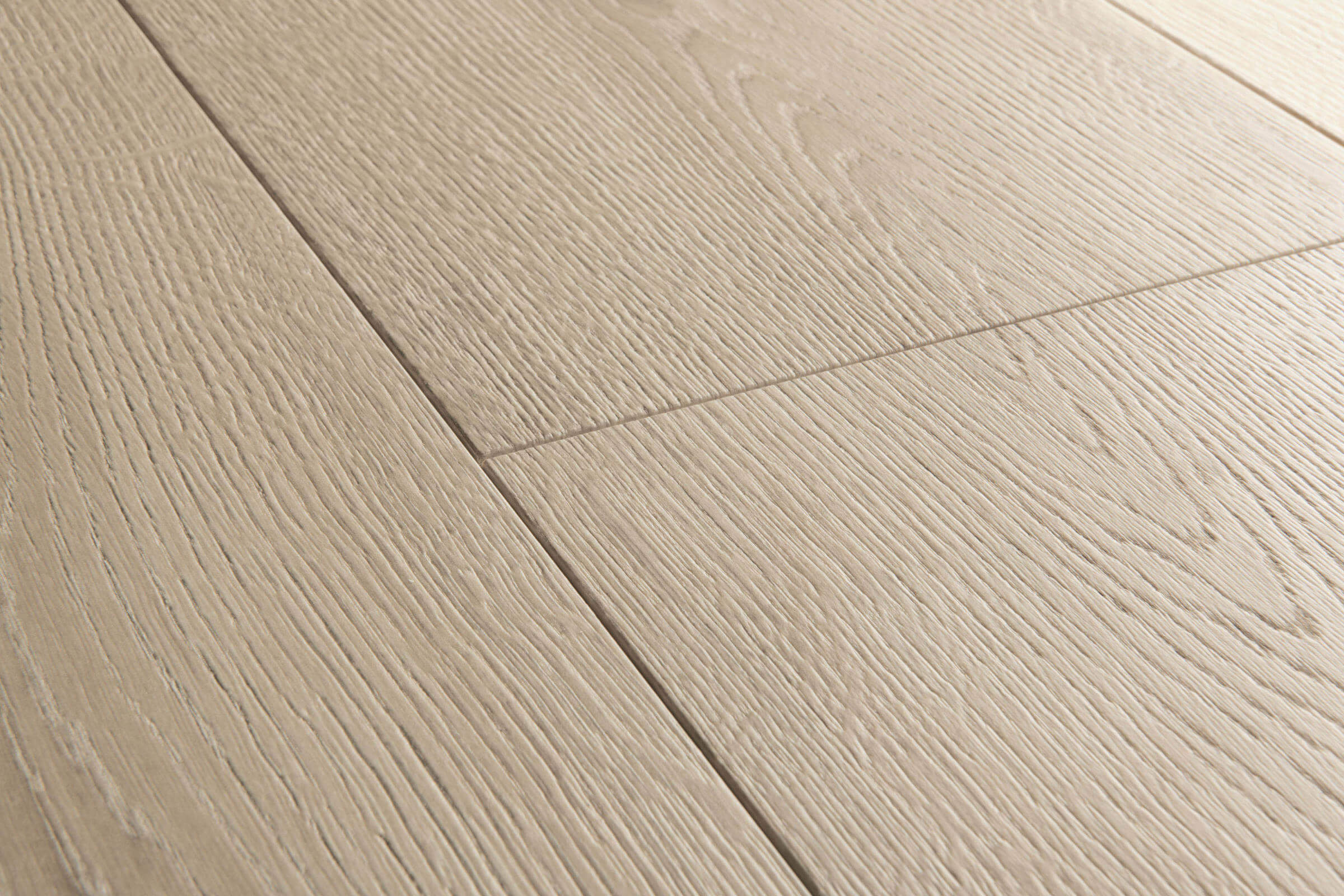 Close-up of a wooden floor with light brown planks.