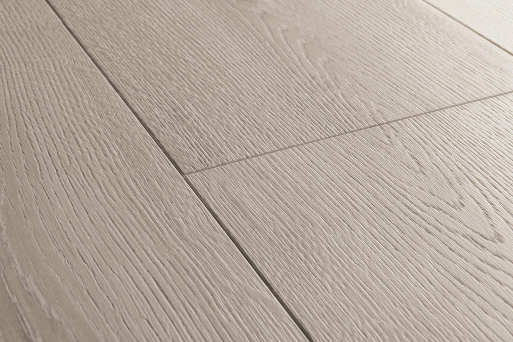 Close-up of gray wooden flooring with a visible grain pattern.
