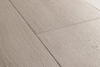 Close-up of gray wooden flooring with a visible grain pattern.