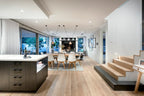 Modern open-plan living area with kitchen, dining, and living room.