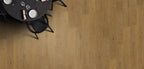 Wooden floor with a round table and chairs in the corner