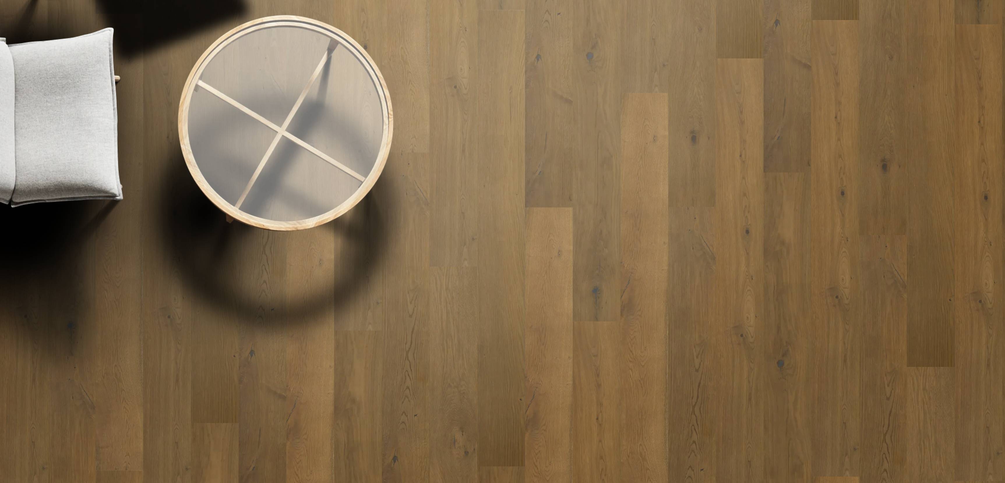 Round metallic object on a wooden floor