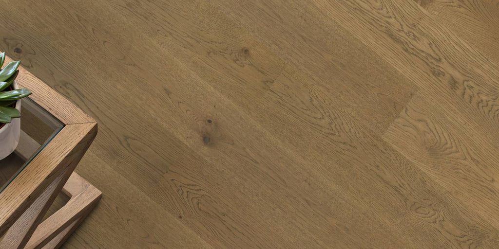 Wooden floor with a wooden table and plant in the corner